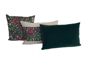 Set of cushions with red flowers on a sandy background and green.