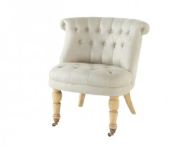 Capitoné cream armchair