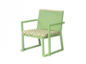 Green Sisley armchair with tropical cushion
