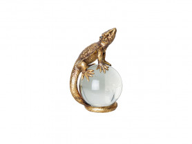 Figura de lagarto dorado con bola